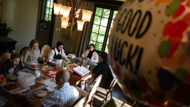 Ahed Bseiso, 18, second from right, recounts being in a building that was hit by an Israeli shell and subsequently having her leg amputated on her kitchen table in Gaza in December during breakfast on Saturday, May 18, 2024. Dr. Reema Wahdan, right, translated for Bseiso at Dr. Omar Mubarak's home in Denver before an appointment to have a prosthetic leg fitted at the Hanger Clinic. Seated to the left of Bseiso is her sister Mona. (Photo by Timothy Hurst/The Denver Post)