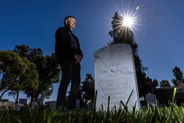 Zaugh, at Pregerson's grave in November, began his ritual visits after the judge, by then a senior member of the U.S. 9th Circuit Court of Appeals, died in 2017. (Irfan Khan/Los Angeles Times/TNS)