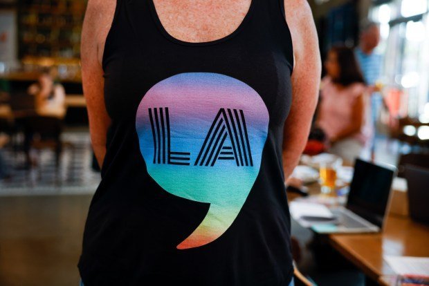 Cate Schroeder, of San Jose, wears a shirt that has Kamala Harris' name printed as a comma and LA at San Pedro Square Market in downtown San Jose, Calif., on Thursday, July 25, 2024. (Shae Hammond/Bay Area News Group)