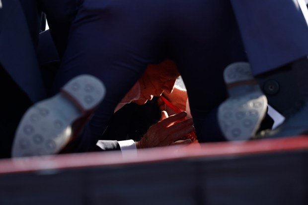 Republican presidential candidate former President Donald Trump is rushed offstage during a rally on July 13, 2024 in Butler, Pennsylvania. (Photo by Anna Moneymaker/Getty Images)
