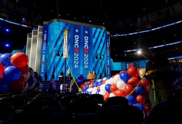 Red, white and blue balloons are bundled and raised to the rafters on Aug. 15, 2024, before the Democratic National Convention at the United Center. (Brian Cassella/Chicago Tribune)